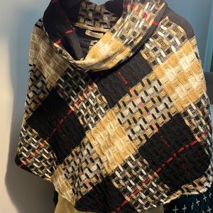 Burberry women will poncho in signature plaid with gold threads
